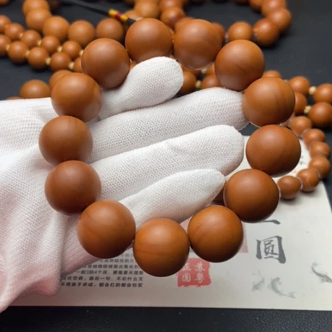 橄榄核核雕1.75鸡血红铁核全品