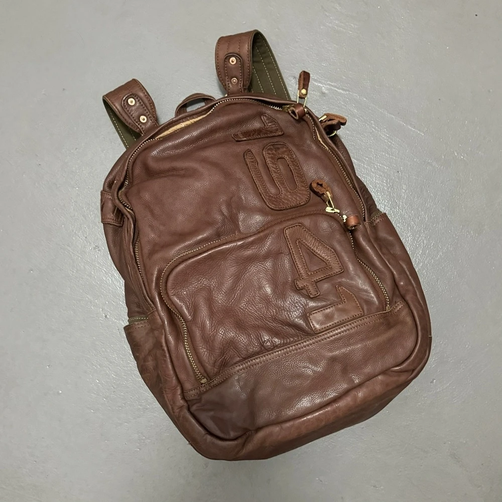 瑕疵亏清！美式复古阿美咔叽水洗做旧真皮双肩包旅游包背包书包男