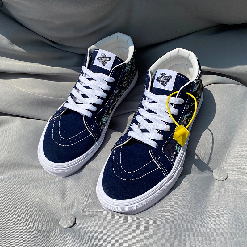 男鞋时尚藏蓝色百搭腰果花中帮2025春季新款爆款男款板鞋男帆布鞋