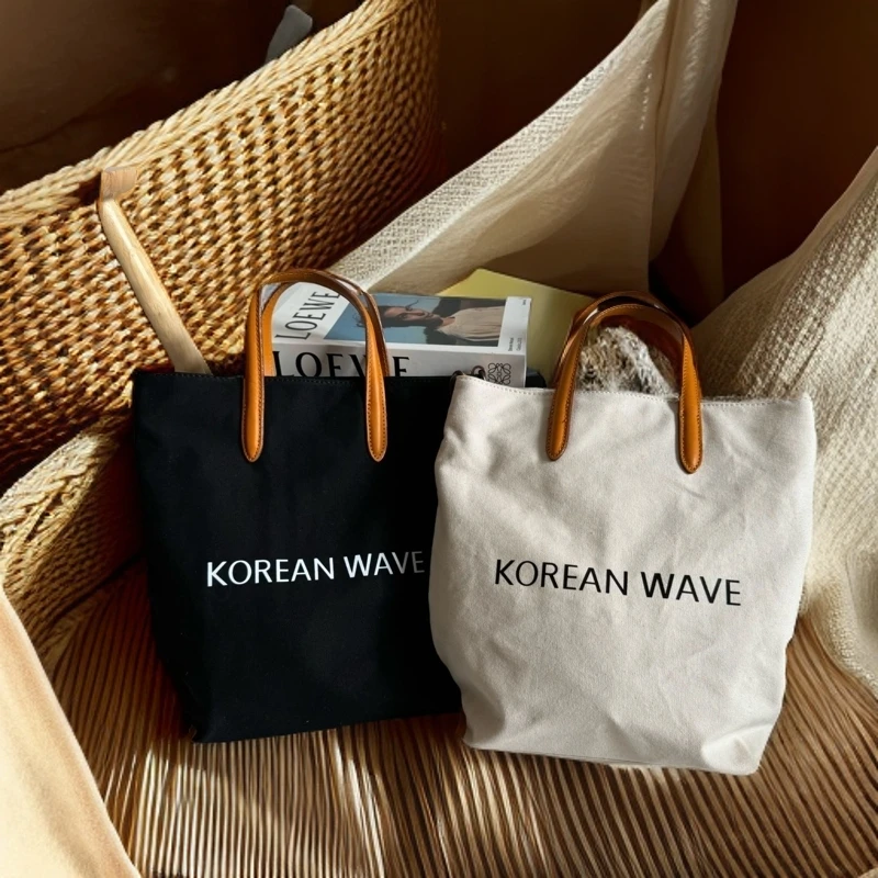 森系手提单肩斜跨包包真皮女包百搭文艺轻便水桶托特包简约便携