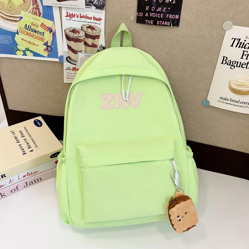 小学生轻便简约双肩包韩版初中生背包一二三年级休闲百搭减负书包