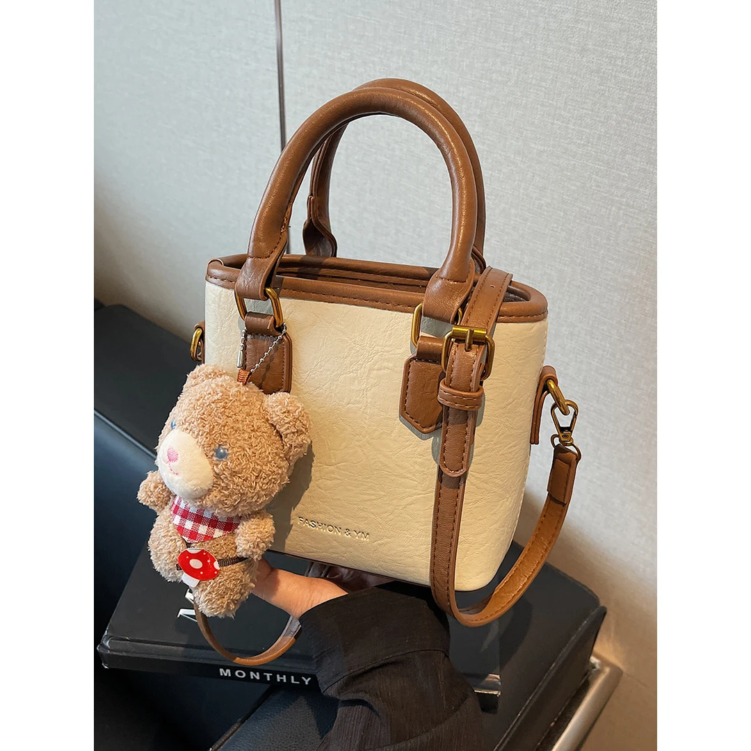 今年流行小包包女2024秋冬新款手提水桶包撞色复古百搭通勤斜挎包