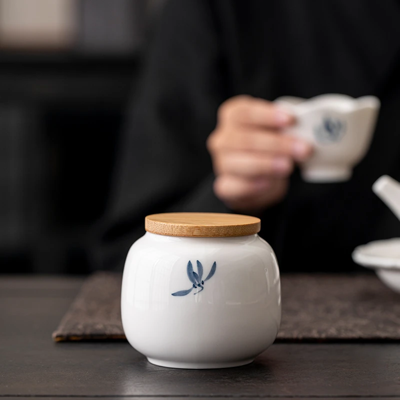 蝴蝶兰花茶叶罐日式功夫陶瓷手绘新款防潮带盖绿茶密封茶盒储存罐
