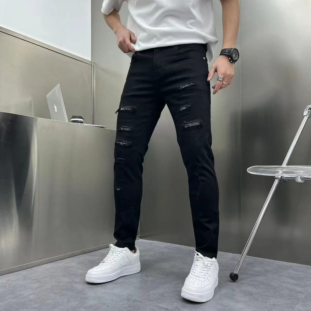 潮流男士潮流牛仔裤破洞烫钻痞帅天花版潮流时尚休闲轻奢百搭