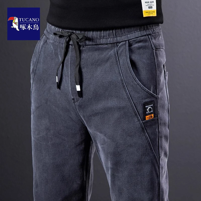 啄木鸟弹力牛仔裤男士秋季修身直筒显高抽绳百搭休闲裤子男潮流