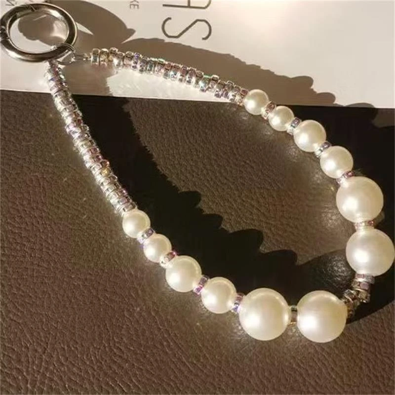 手机挂绳短款手腕挂链高端时尚珍珠吊坠女轻奢水钻锆石串珠潮挂链