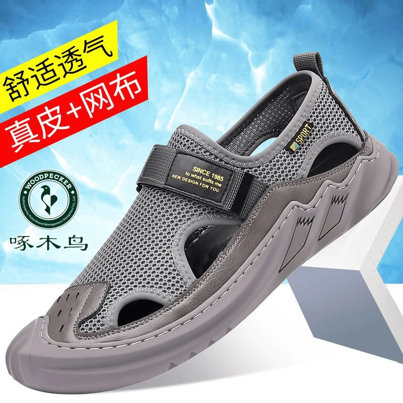 啄木鸟凉鞋新款夏季潮流百搭透气男士软皮包头软底网面休闲沙滩鞋