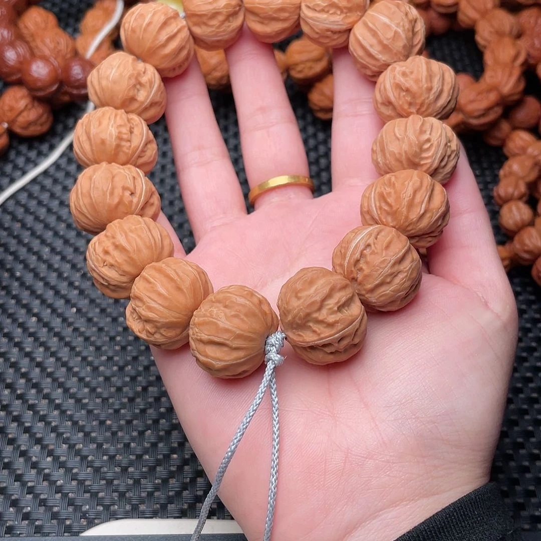 桃核吊坠沐磨盘手持