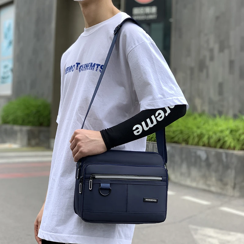 单肩包斜挎包通勤包韩版潮流商务休闲百搭防水多口袋耐磨男士包包