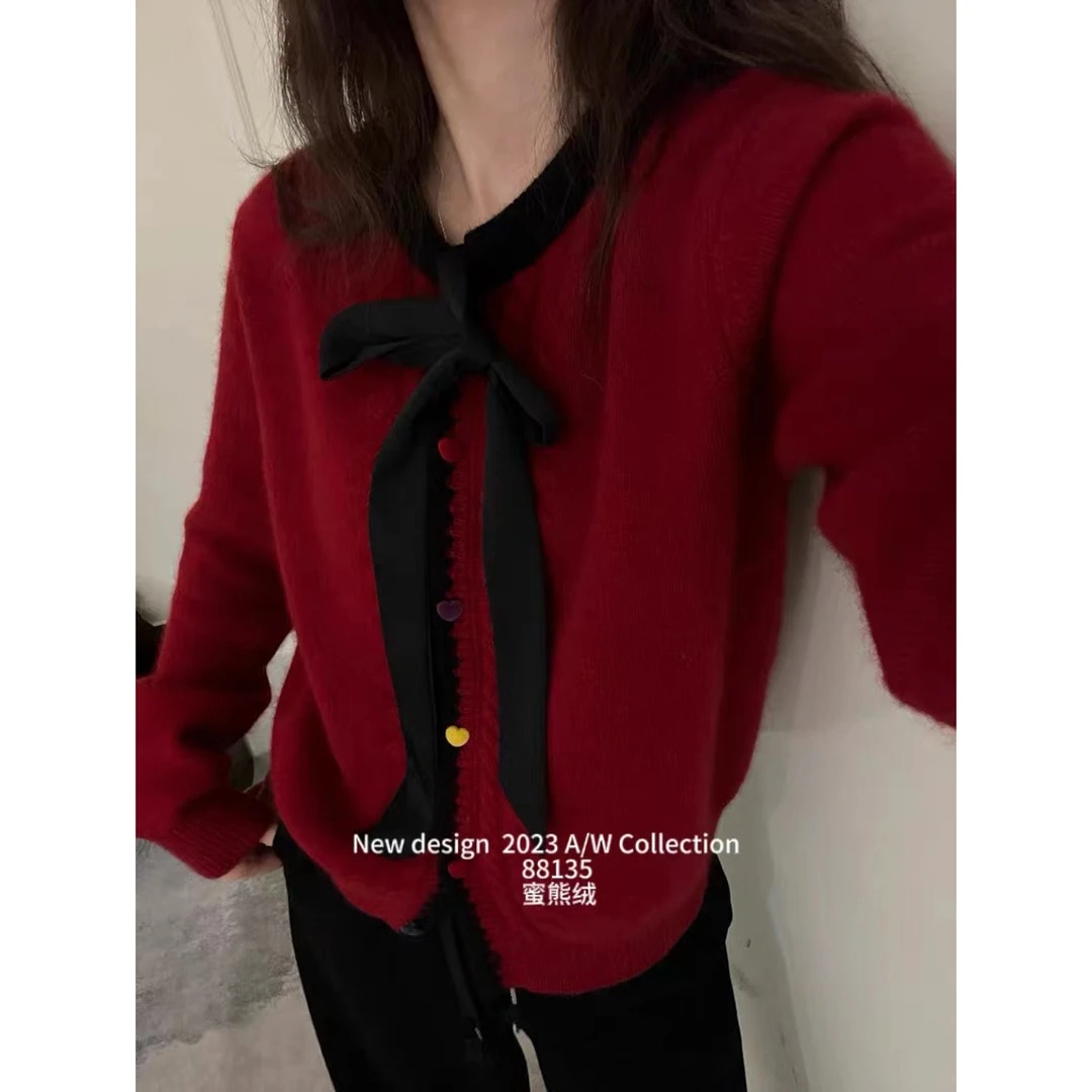 妮妮家冬季款休闲百搭时尚飘带彩扣开衫68135