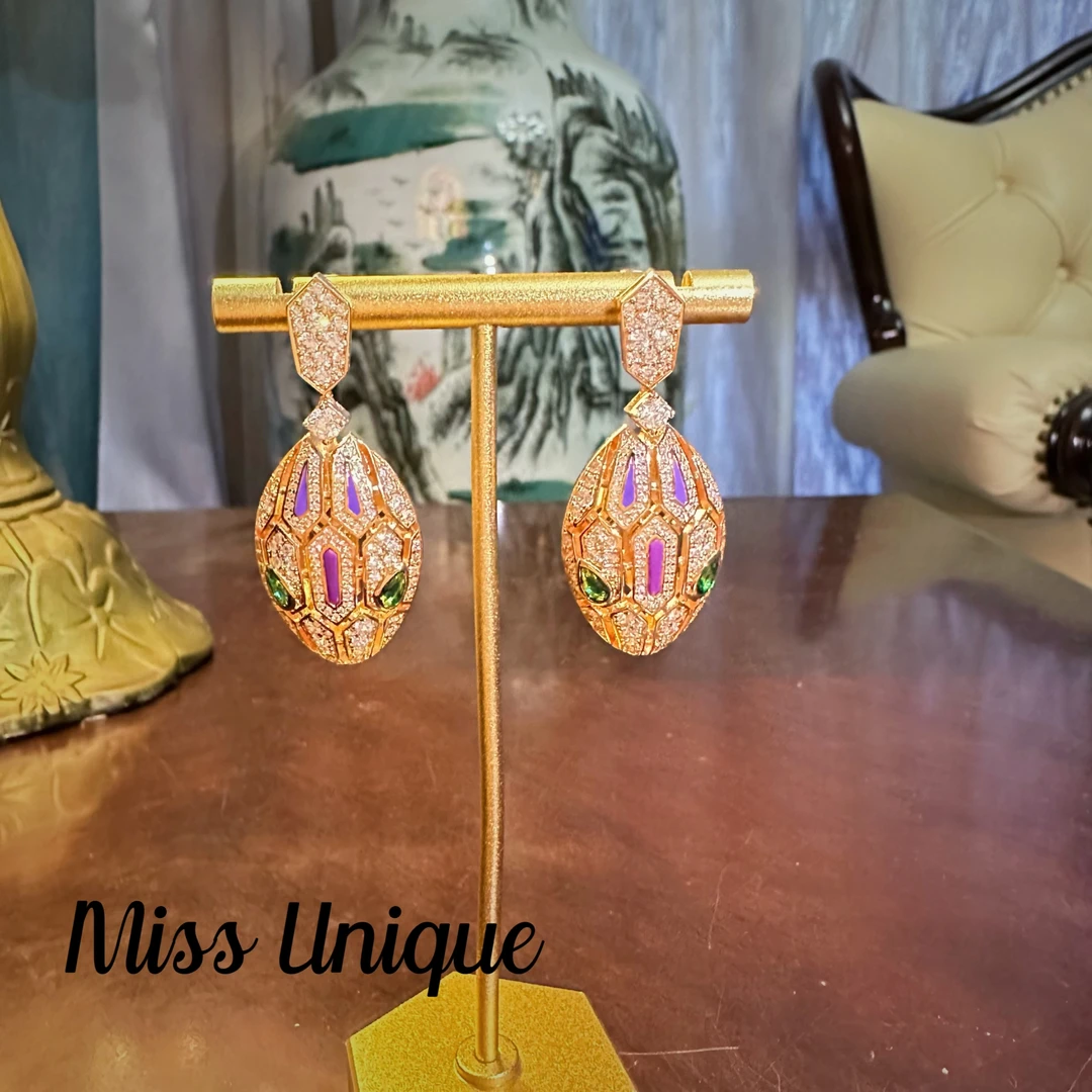 S6086紫色镂空灵蛇耳环