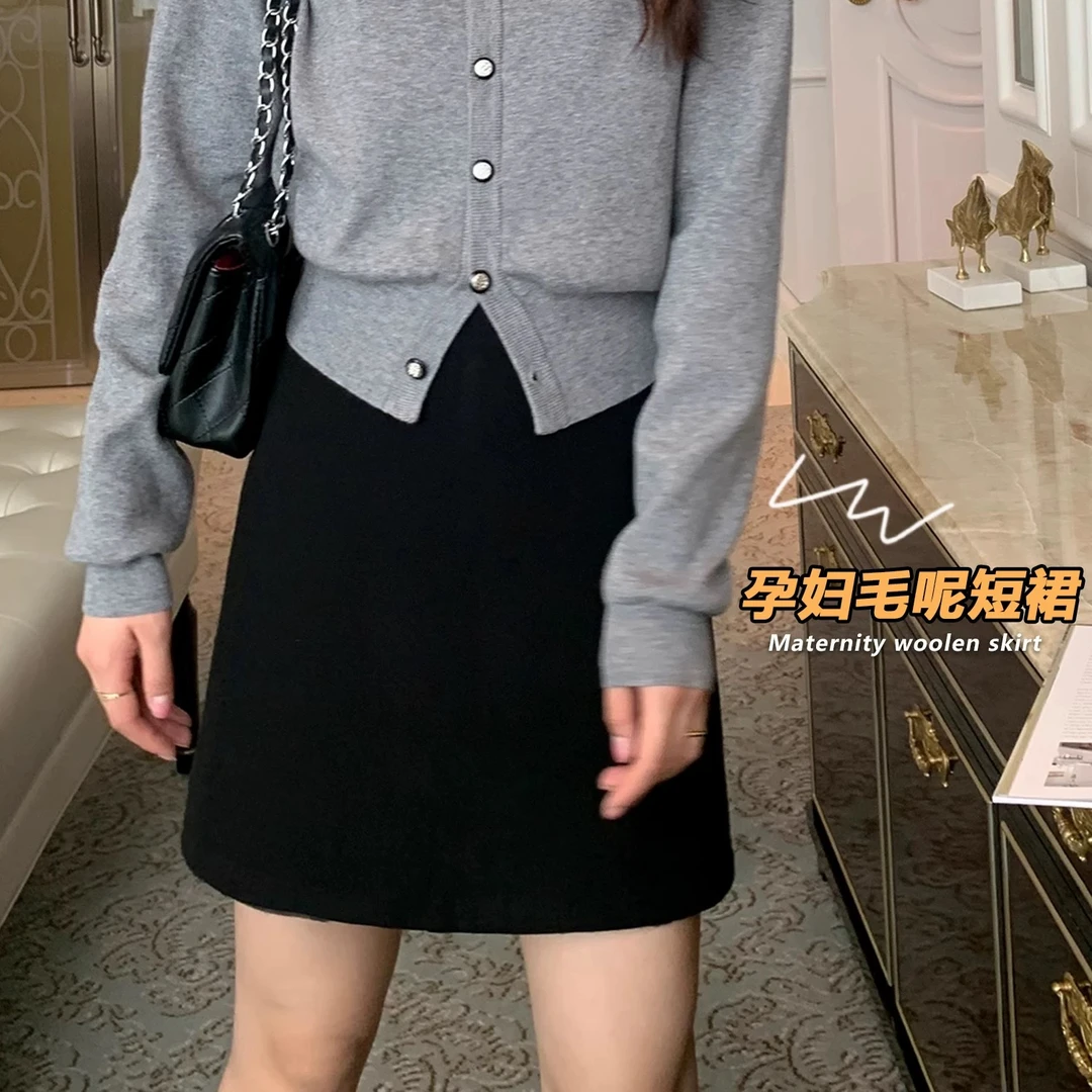 孕妇黑色毛呢包臀短裙秋冬季新款韩版显瘦外穿A字托腹半身裙子潮
