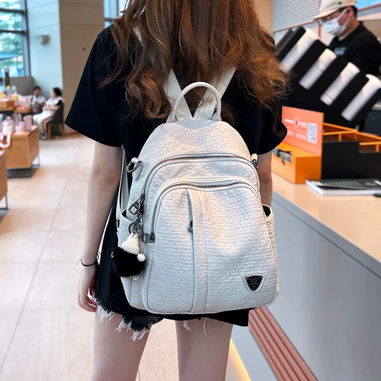 2025新款春夏白色软皮双肩包女多口袋休闲旅游背包时尚百搭单肩包