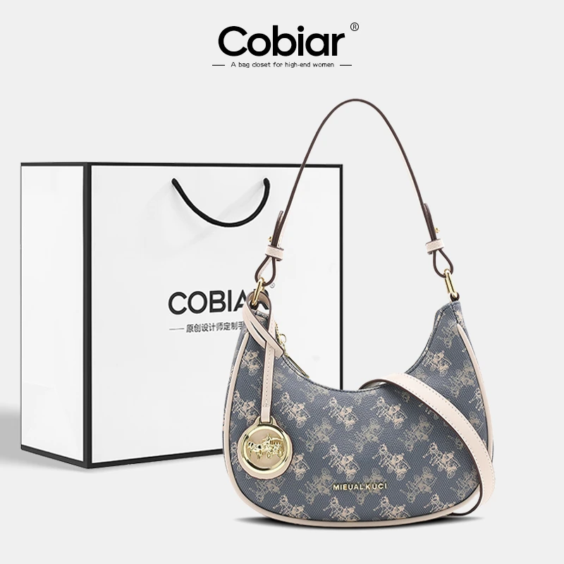Cobiar高级感法式腋下包女2025新款时尚单肩法棍月牙包百搭斜挎包
