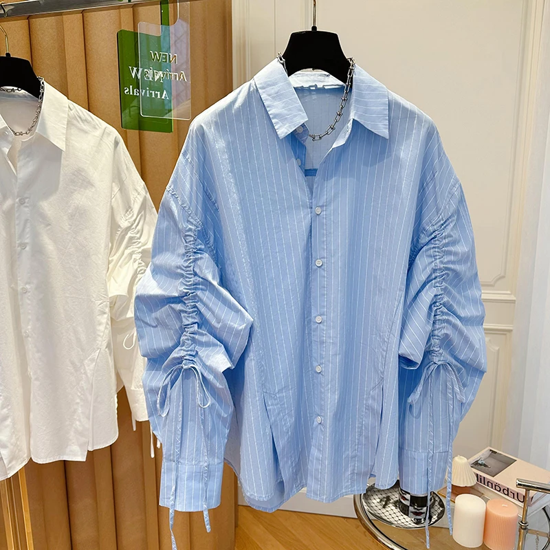 2024新款设计感小众宽松袖子抽绳蓝色条纹衬衫女春装下摆开叉上衣