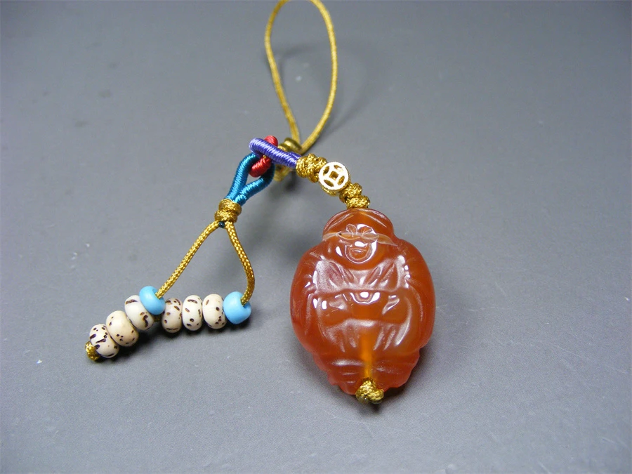 几十年的柿子红缠丝玛瑙通天孔手工雕圆雕捧元宝童子小坠