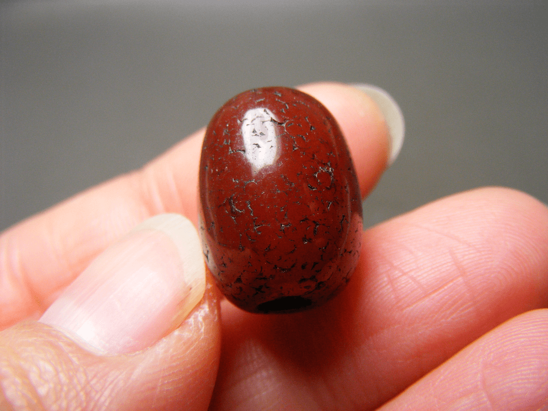 老西亚上百年的酒红色缠丝玛瑙中号长管珠