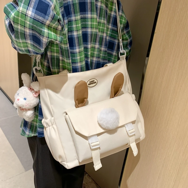 2023新款手提袋小学生补习袋大容量初中生兔子耳朵斜挎包单肩包