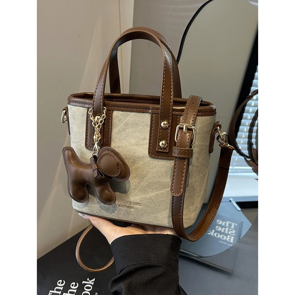 时尚手提水桶包包女式2024新款秋冬韩版百搭斜挎包小众通勤单肩包