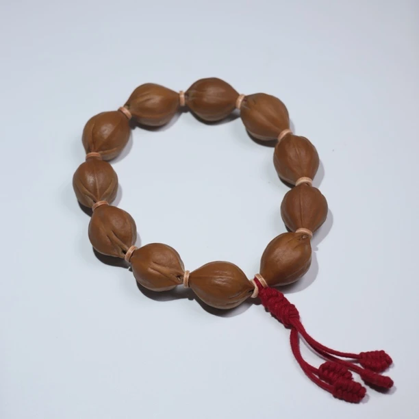 橄榄核梅林铁核小籽手串直心三面佛