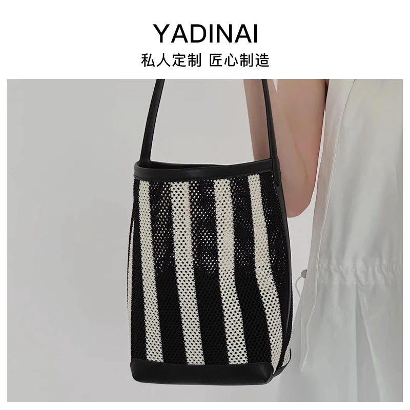 YADINAI女士包包2024新款夏季编织牛皮单肩腋下包条纹水桶包