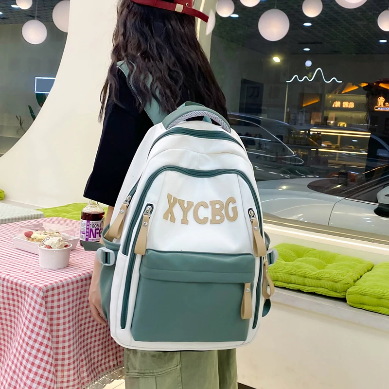 书包潮流双肩包轻便休闲包大容量学生包防泼水多格层双背包