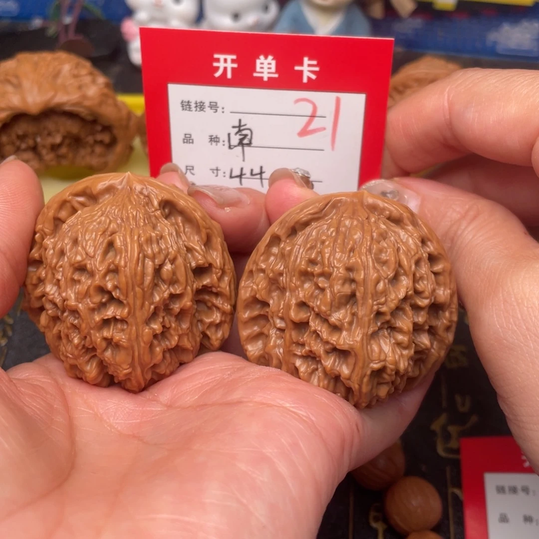 桃核吊坠小*?文玩城的小