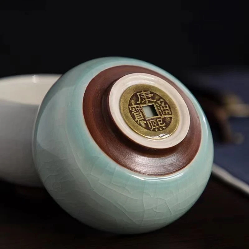 汝窑冰裂纹茶杯主人杯陶瓷品茗杯开冰裂釉皮康熙通宝底款铜钱杯