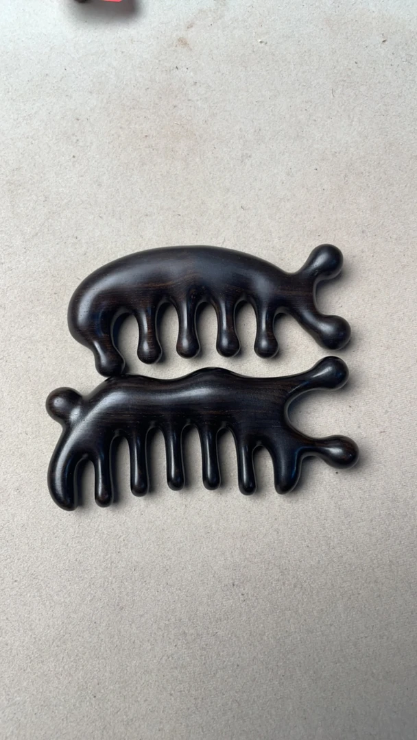 乌木紫光檀蜗牛经络按摩梳头皮肩颈多功能按摩