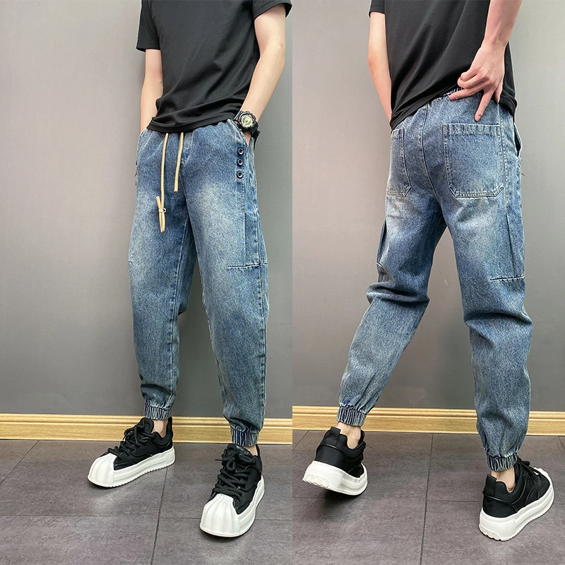 潮流男士新款扣子牛仔裤松紧腰宽松哈伦裤水洗做旧青少年小束脚裤