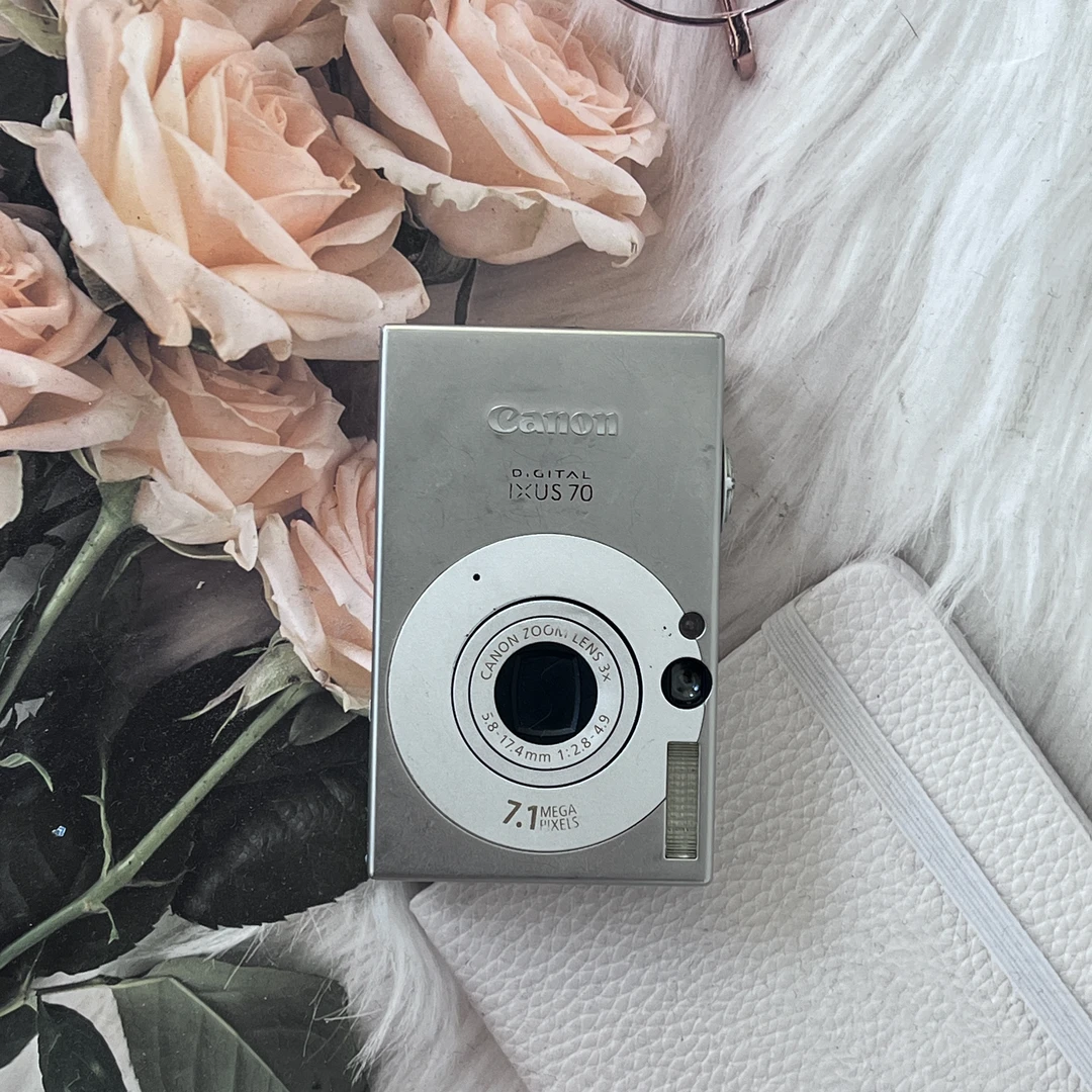 9新 Canon/佳能 ixus70银色柔焦氛围下单默认no退换