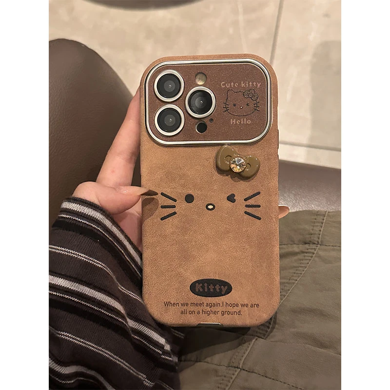 棕色皮革可爱猫咪立体蝴蝶结手拎手机壳适用苹果16/15/14/promax