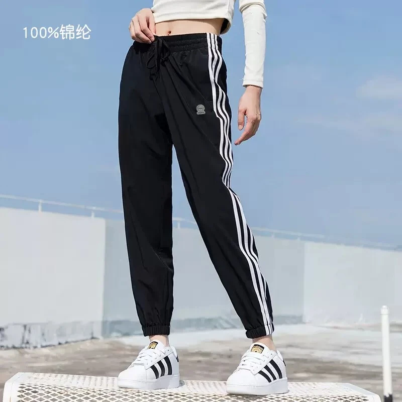 Adidas阿迪达斯女裤夏款薄款运动裤梭织跑步条纹透气束脚裤HF7283