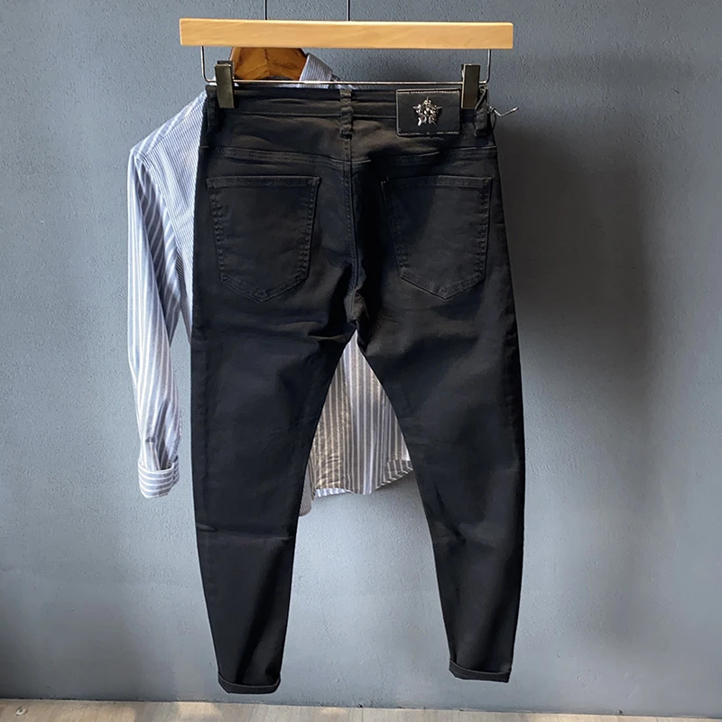 纯黑色紧身牛仔裤男修身小脚弹力长裤春秋季2025新款韩版潮流裤子