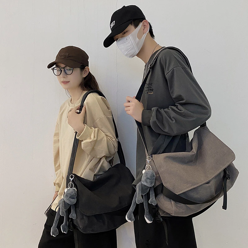 男女同款斜挎包ins潮牌复古新款慵懒休闲包包帆布邮差包单肩包