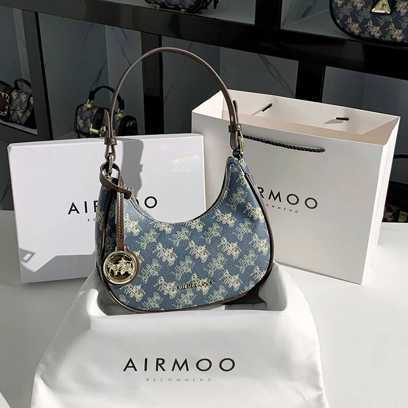 AIRMOO/艾姆轻奢真皮包包女士高级感斜挎月牙包百搭法棍腋下包