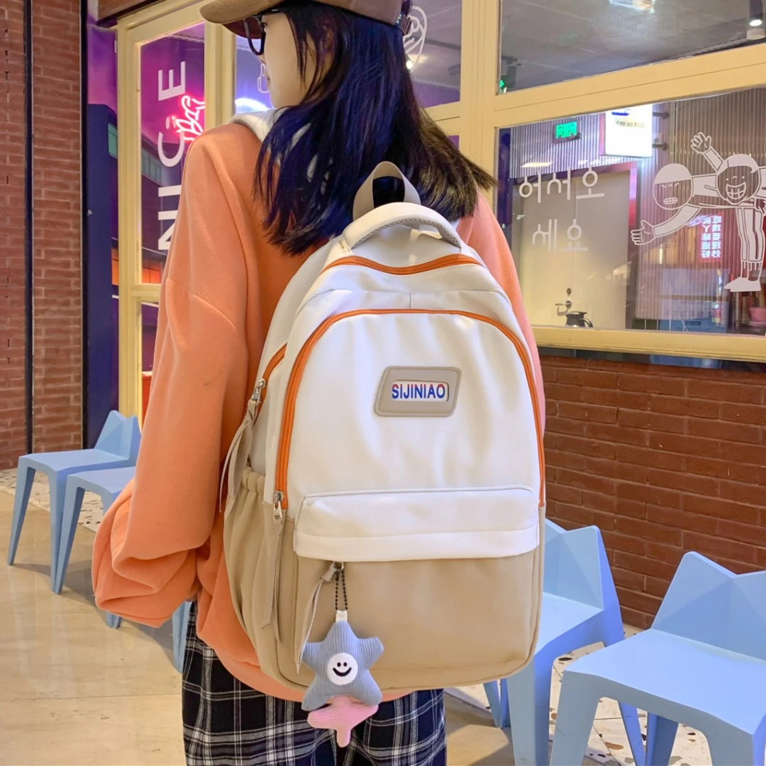 减负护脊书包女学生四五六年级大容量双肩包初高中生男帅气背包女