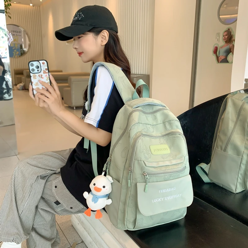 书包中学生初中生2024新款大学生简约百搭多层小众设计感少女背包