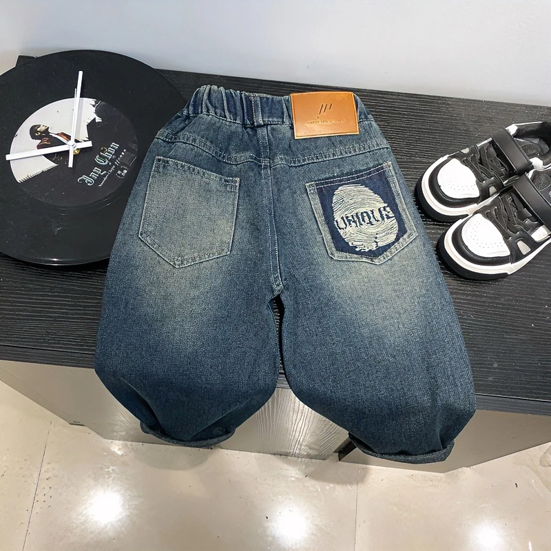 Q07秋季儿童新款后袋指纹刺绣牛仔长裤