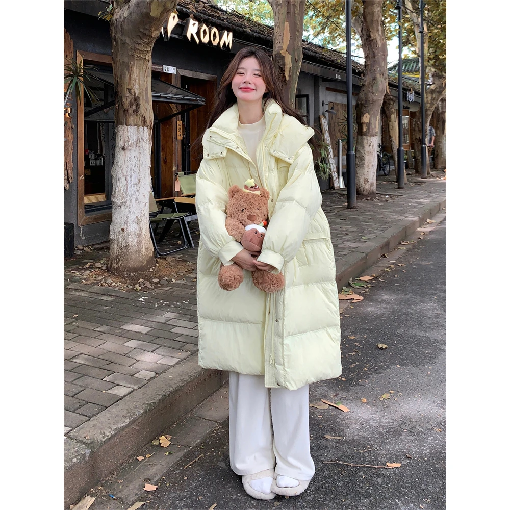 奶黄色收腰中长款羽绒服女冬季2024新款温柔风少女爆款高级感流行