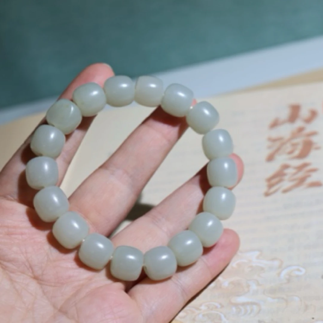 天然新疆和田玉珠子原皮两颗11.3×12.1手串暖白色细度油性好