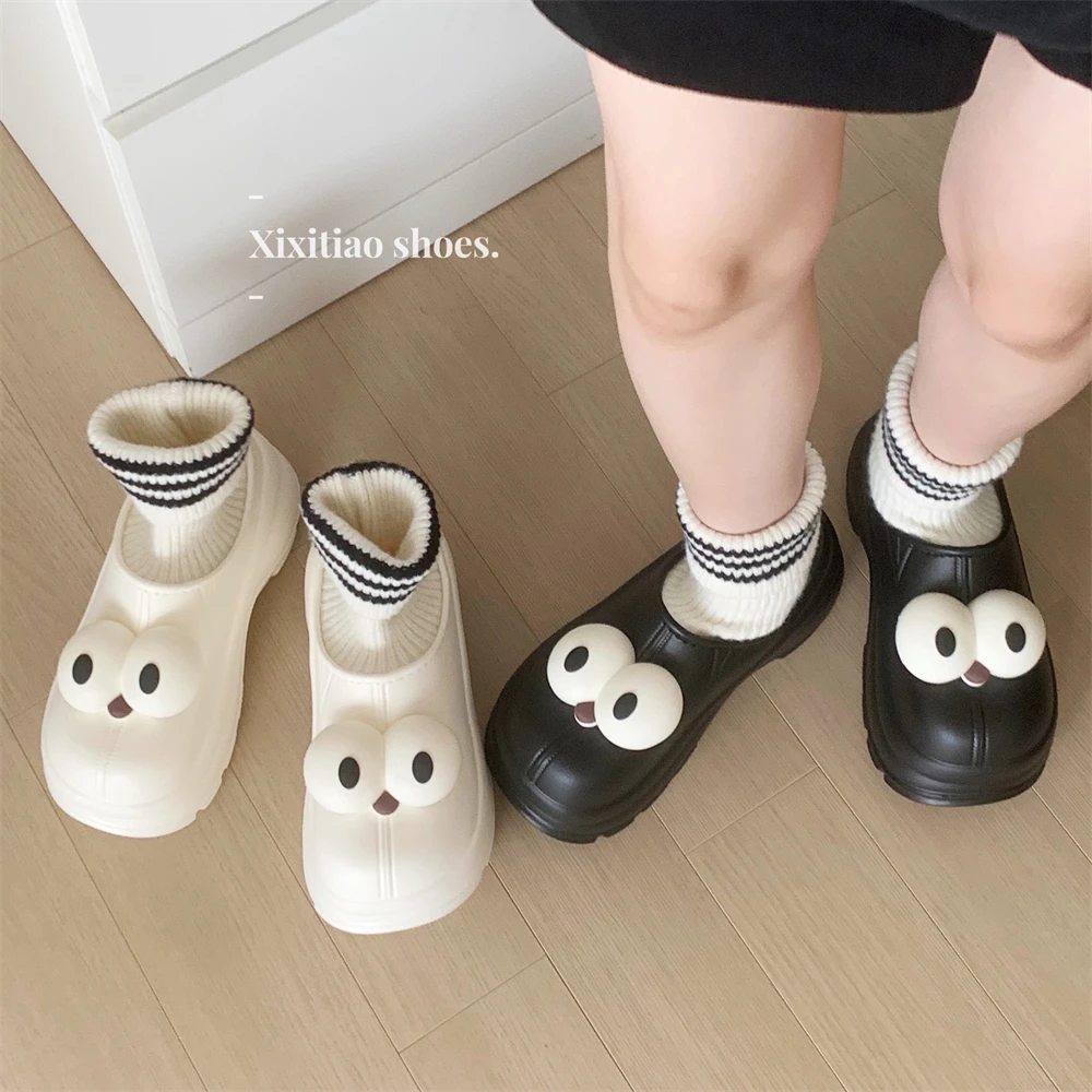 细细条 运动风软底保暖学生连袜棉靴搞怪大眼仔防水防滑短筒靴女