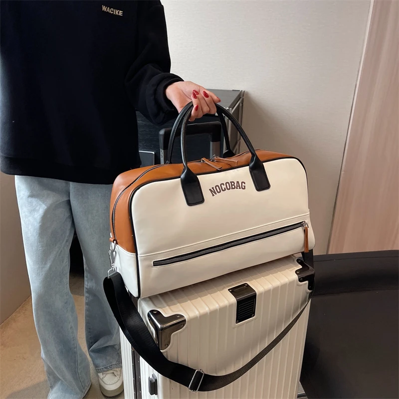 新款短途女旅行包简约时尚百搭单肩斜挎手提健身包男收纳包登机包