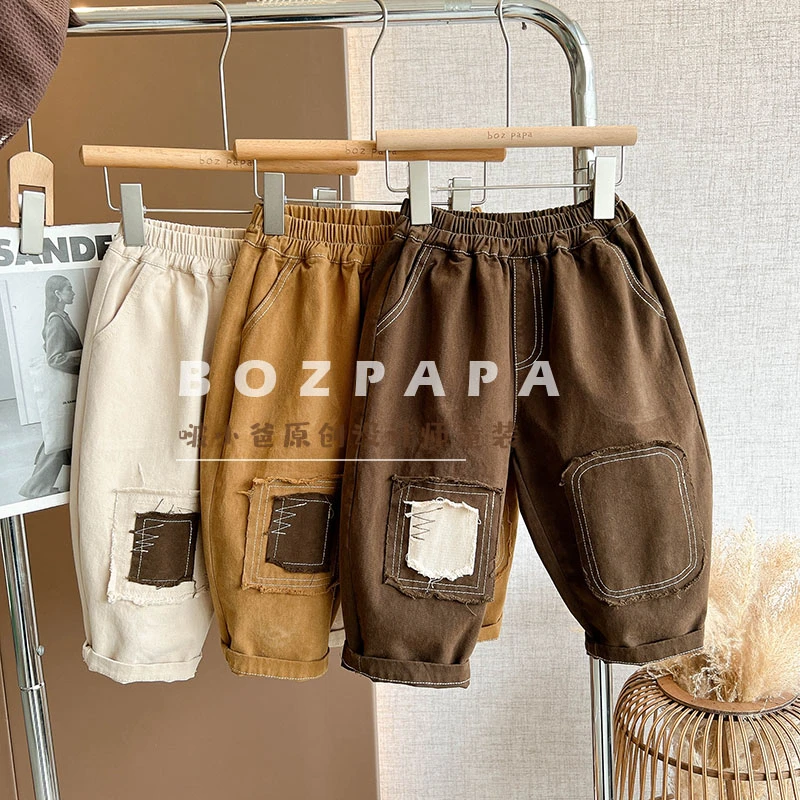 现货韩版新款秋款男宝女宝设计师不规则补丁裤子儿童网红炸街童装