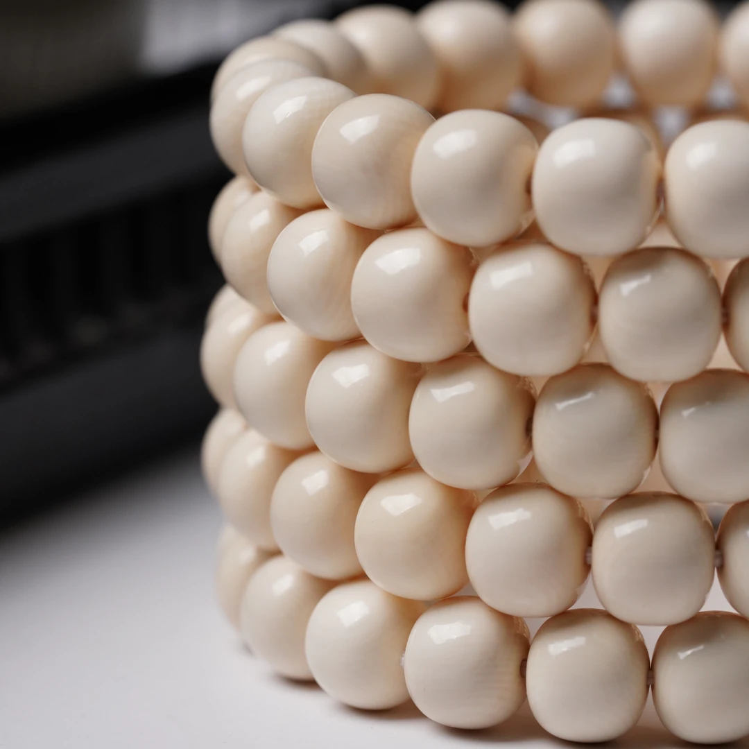 C003毕业5A级猛犸牙手串约10×9mm/21粒(实尺9.8x8.8)老型精工归圆