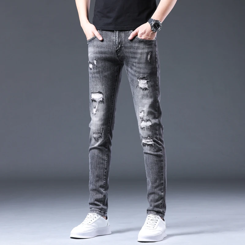 DQ1353两色秋季新款破洞补丁牛仔裤男潮牌修身小脚弹力百搭男长裤