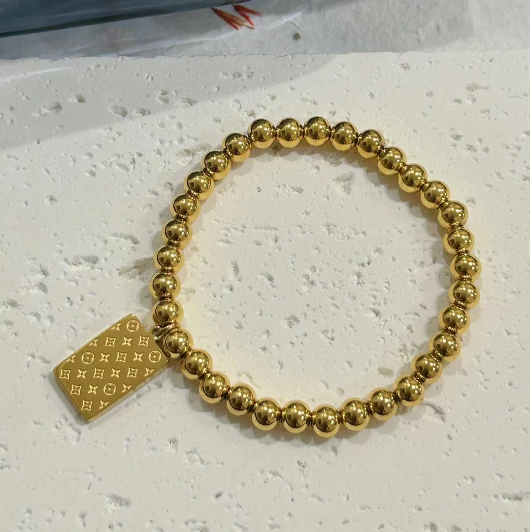 钛钢手链 【Kiss娜】钛钢1931气质弹力绳6mm珠珠花牌手链