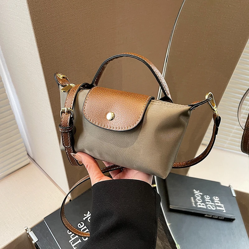 小包包女2025辛苦小组迷你手提饺子包高级感尼龙布单肩斜跨手机包