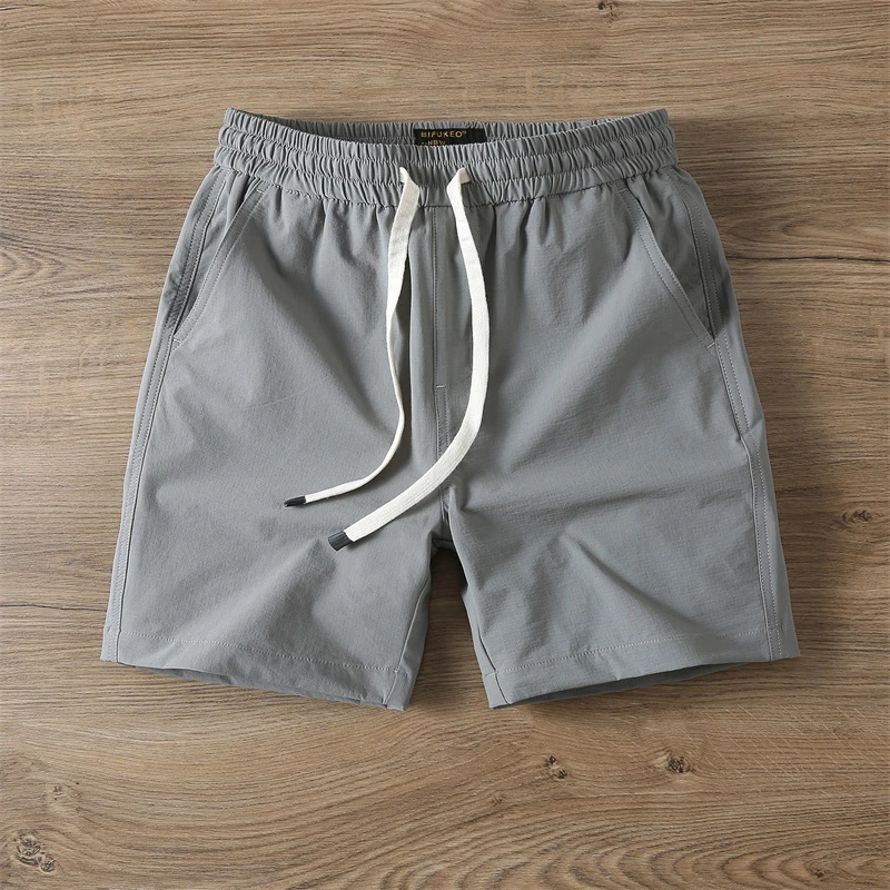 夏季男士速干短裤纯色沙滩裤男弹力休闲四分裤ins薄款冰丝运动裤