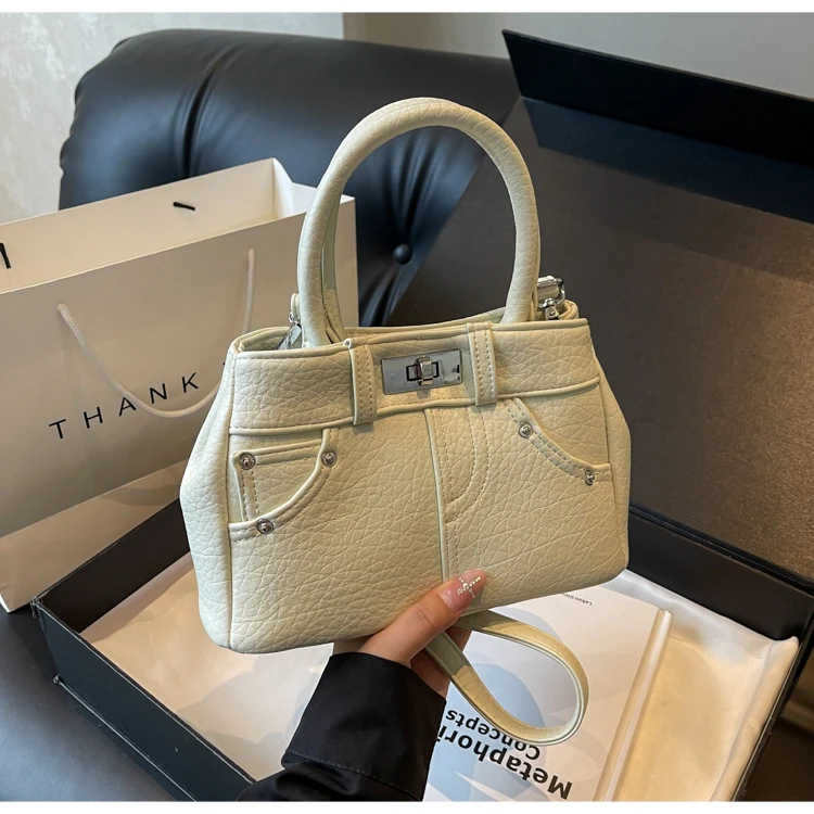 潮流时尚手拎包包女2025新款韩版简约百搭水桶包高级感小众单肩包